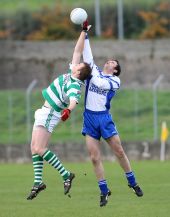 Seán O'Hare rises for the ball in the County Final v Ardmore