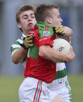 Brian Looby making it difficult for his opponent during the County Senior Football Championship match played at Fraher Field