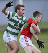Brian Looby tries to dispossess his opponent during the County Senior Football Championship match v Clashmore played at Fraher Field