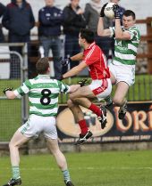 James O'Mahony leaps high into the air to claim the ball ahead of his Stradbally opponent during the County Senior Football Championship played at Fraher Field