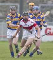 David Collins, Michael O'Halloran and John Hurney surround their De La Salle opponent during the County Senior Hurling Championship match at Walsh Park