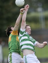 Gary Hurney fists the ball ahead of his opponent during the County Senior Football Championship match against Kilrossanty played at Fraher Field
