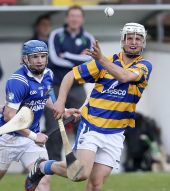 Mark Ferncombe handpasses to an Abbeyside team mate during the County Senior Hurling Championship match v Fourmilewater at Fraher Field