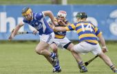 Mark Fives and Mark Gorman seek to dispossess their Fourmilewater opponent during the County Senior Hurling Championship encounter at Fraher Field