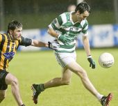 Michael Maher solos away from his opponent during the Western Intermediate Football Final at Fraher Field