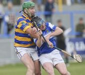 Seán O'Hare makes it difficult for his Mount Sion opponent to get a shot at goal during the County Senior Hurling Championship game played at Walsh Park