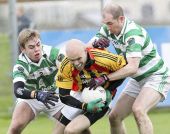 Brian Looby and Shane Briggs battle to regain possession during the Munster Club Senior Football Championship Quarter Final clash against Dromcollogher-Broadford at Fraher Field