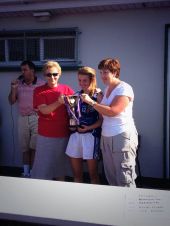 Ursula Walsh and Antoinette Enright present the Mary and Mollie Cup to Dungarvan's captain, Lauren McGregor