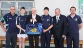Gregor McNabb, GSK presenting kit bags to Féile Panel along with GAA President, Liam O'Neill, Captains and Mentors