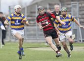 Richie Foley and Mark Gorman chase their Ballygunner opponent during the County Senior Hurling Championship Semi Final at Walsh Park