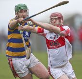 Seán O'Hare battles for possession during the County Senior Hurling Championship clash with De La Salle at Walsh Park