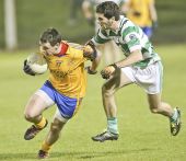 Conor Moloney chases his Nire opponent in the County Senior Football Semi Final clash at Fraher Field