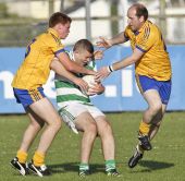 Ronan Sheehan sandwiched between two Nire players during the Round 3 game of the County Senior Football Championship