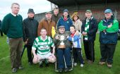 John Morrissey holding the Conway Cup along with Pakie Hurney, captain John Hurney and supporters